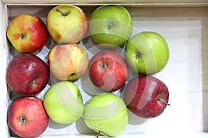 Greengrocers discount price. Pile of apples on market counter