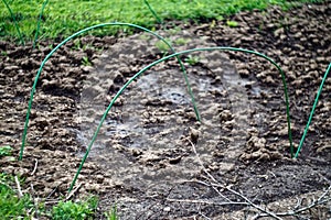 Greenhouse arcs without film in the garden