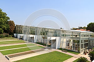 Greenhouse with artificial waterfalls in botanical garden Orto botanico in Padua, Italy