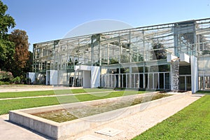Greenhouse with artificial waterfalls in botanical garden Orto botanico in Padua, Italy