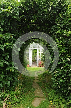 Greenhouse door seen through an archway