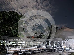greenhouse view with cloudy night sky