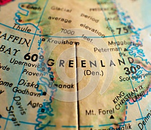Greenland focus macro shot on globe map for travel blogs, social media, web banners and backgrounds.