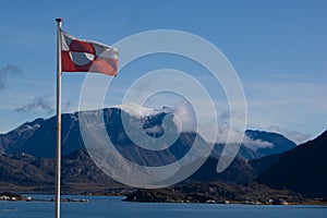 Greenland shoreline with flag photo