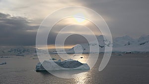 Greenland. Summer Midnight Sun and icebergs. Disko Bay glacier during midnight sun season of polar summer. Ilulissat