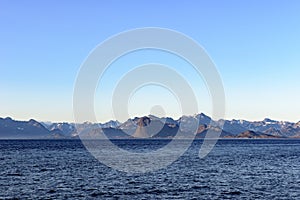 Greenlandic coastline with uninhabitated mountains photo