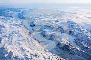Greenlandic ice cap with frozen mountains and fjord aerial view, near Nuuk, Greenland photo