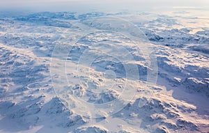 Greenlandic ice cap with frozen mountains and fjords aerial view, near Nuuk