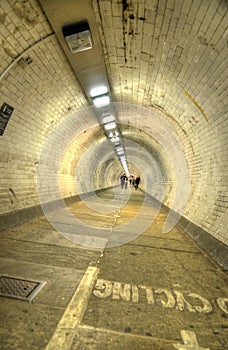 The Greenwich Foot Tunnel crosses beneath the River Thames in East London