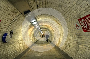 The Greenwich Foot Tunnel crosses beneath the River Thames in East London