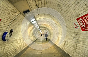 The Greenwich Foot Tunnel crosses beneath the River Thames in East London