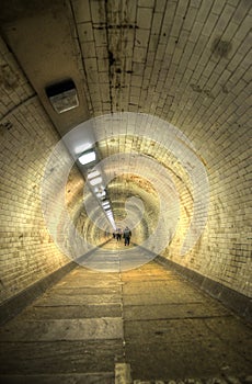 The Greenwich Foot Tunnel crosses beneath the River Thames in East London