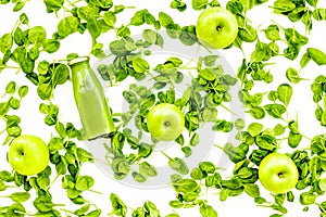 Greeny vegetable smoothie in bottle with apples on white background top view mock up