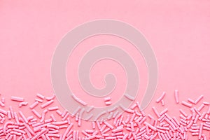 Greeting background of soft sprinkles over pink, festive invitation for Valentines day, birthday, holiday and party time, copy