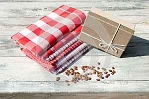 Greeting card. Birthday gift box with stack of tableclothes and