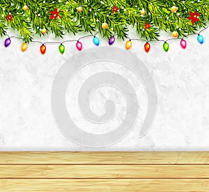 Greeting card with christmas tree branches, garlands and wood table top. Merry Christmas and Happy New Year greeting background