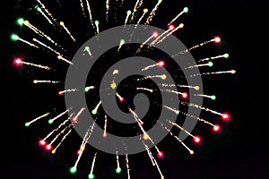 Greeting card. fireworks on a black background, golden sparks and firecrackers