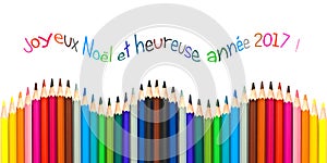 Greeting card with french text meaning happy new year 2017 greeting card, colorful pencils on white background