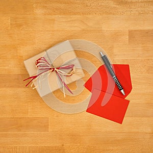 Greeting card and gift, high angle view