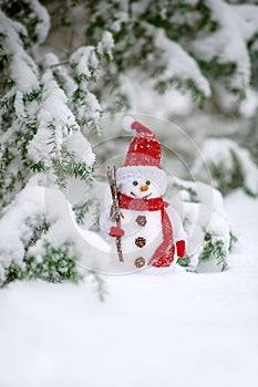 Greeting card with handmade snowman decoration in the forest winter time