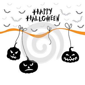 Greeting card with hanging Halloween pumpkins