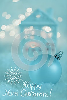 Greeting card Happy Merry Christmas. Blue Ball and Beautiful blurred background of winter decoration for the holiday. Soft focus