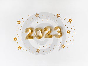 Greeting card - happy new year with numbers 2023 and gold glitter on white background