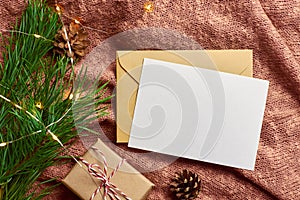 Greeting card mockup with gift box and pine tree branch