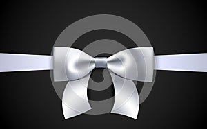 Greeting card with realistic white bow on a black background