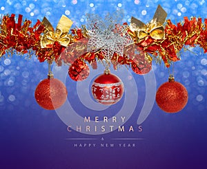 Greeting card with red Christmas balls and red tinsel garland