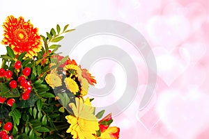 Greeting card template. Decorative bouquet of flowers over abstract blurred hearts background with copy space for text. Spring,
