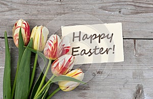 Greeting card with tulips and English text: Happy Easter