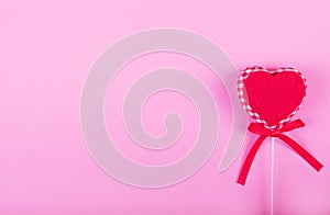 Greeting Card for Valentine`s Day. Red heart on pink background. Copy space. Flat lay