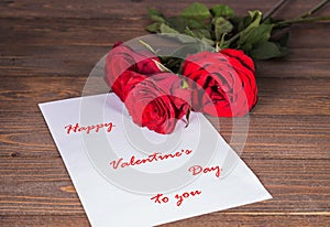 Greeting card with the Valentine`s Day with three red roses