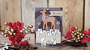 Greeting card on wood background with wood snowflake