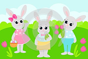 Greeting Easter card. Easter bunnies are standing in the middle of a green meadow.