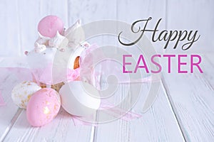 Greeting Easter card. Easter cake, eggs with a congratulatory inscription on a light wooden background