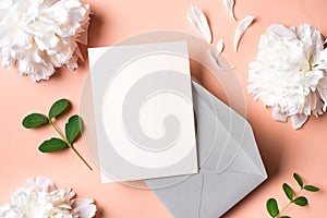 Greeting or invitation blank card and peony flowers