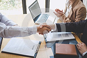 Greeting new colleagues, Handshake while job interviewing, male candidate shaking hands with Interviewer or employer after a job