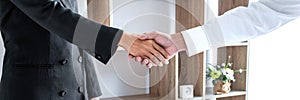Greeting new colleagues, Handshake while job interviewing, male candidate shaking hands with Interviewer or employer after a job