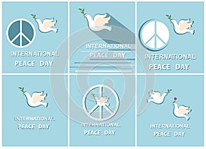 Greeting pastel blue cards with paper cut out doves and peace symbol for International Peace day. Flat design