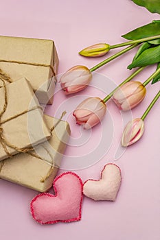 Greetings card, wallpaper, backdrop. Happy Mothers Day, Easter, St.Valentines or Wedding. Gentle pink tulips, handmade felt hearts