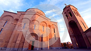 Gregorian christian church in Yerevan Armenia made of traditional armenian pink tuff stone photo
