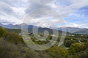 Gremi village in Alazani valley and Caucasian Mountains in the distance. Georgia photo