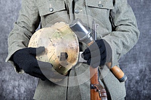 Grenade and helmet of the German soldier in a jacket the second world war