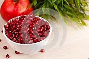 Grenadine seeds with fruit and leaves photo