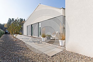 Grey backyard of modern suburban house