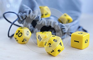 Grey bag, or pouch. Dices for rpg, board games, tabletop games or dungeons and dragons.
