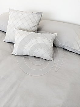 Grey bed linen and pillows