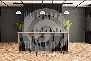 Grey and black cafe bar table with decoration on parquet floor